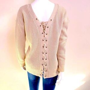 Oversized tan V-neck sweater with lace up back.